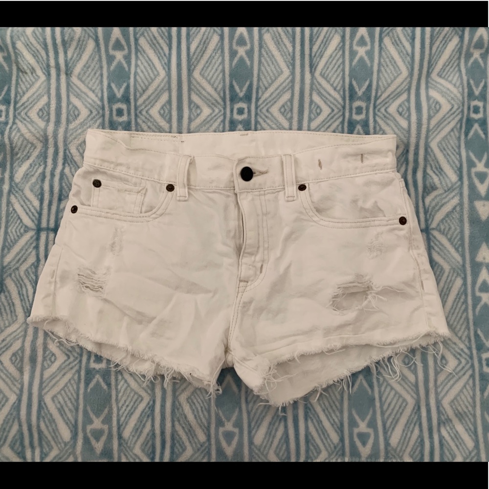 White distressed shorts